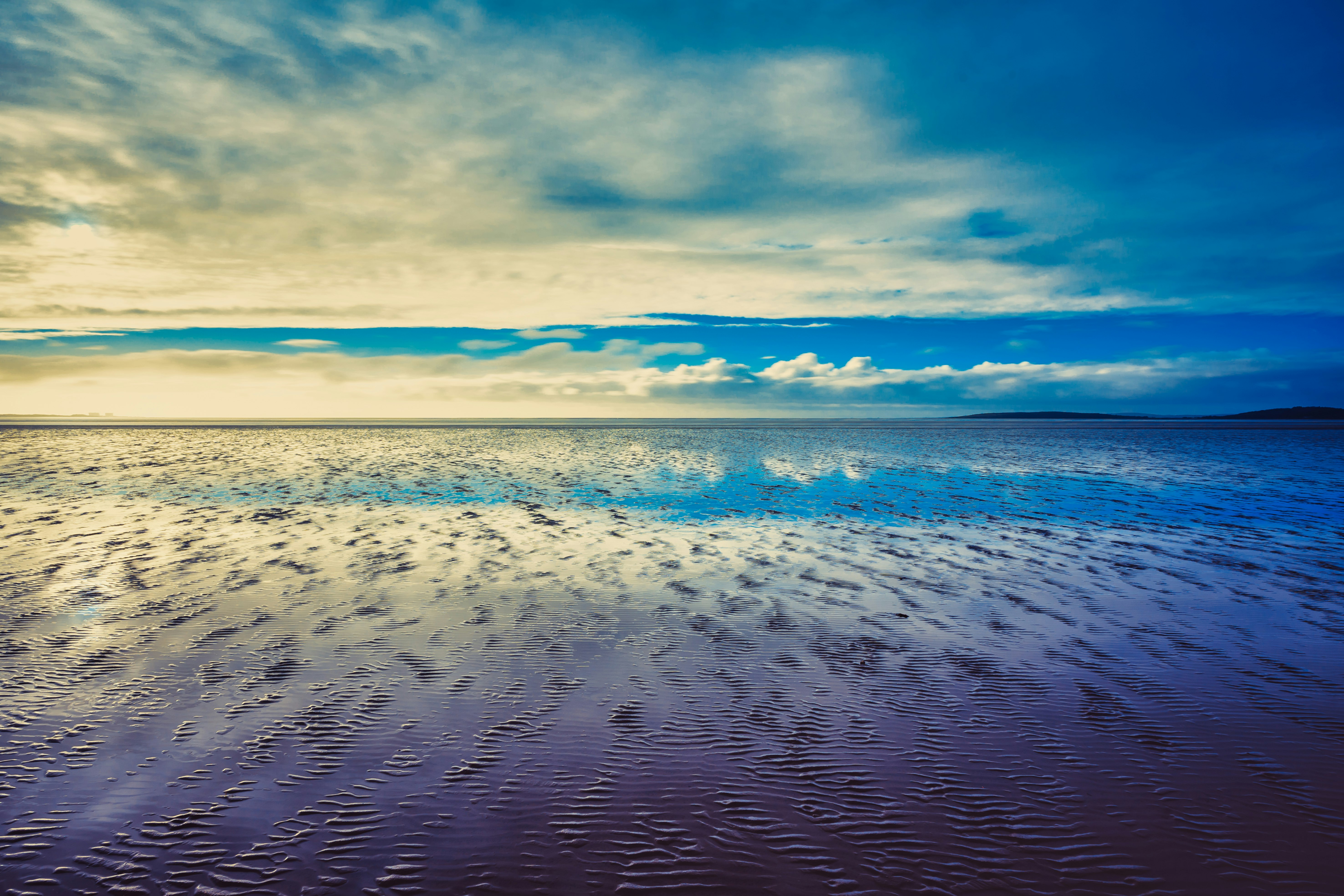 blue sky and white clouds over the sea